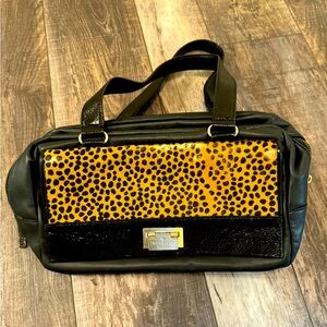 Kate Spade Satchel with patent leather handles and calf hair front flap.